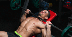 Man performing barbell bench press chest workout in gym for muscle growth