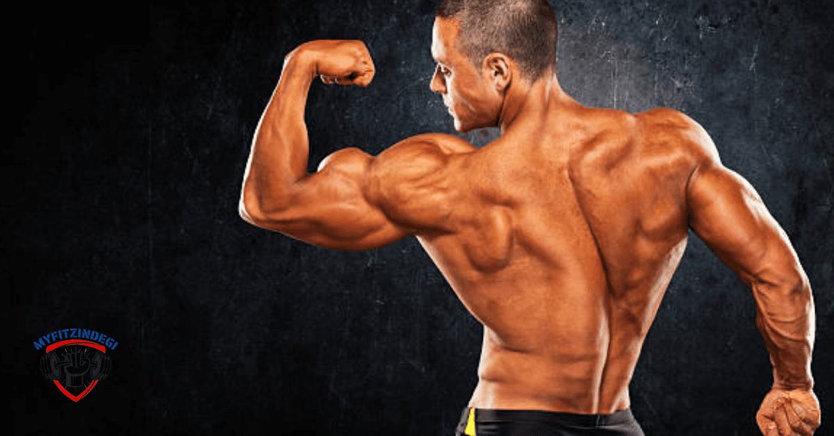 Man performing dumbbell overhead press during shoulder workout